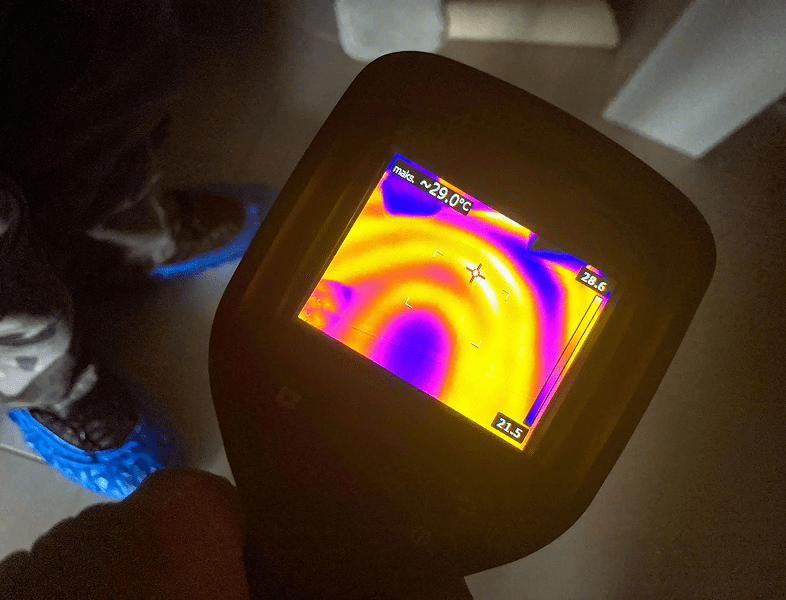 Thermal imaging device showing heat patterns.